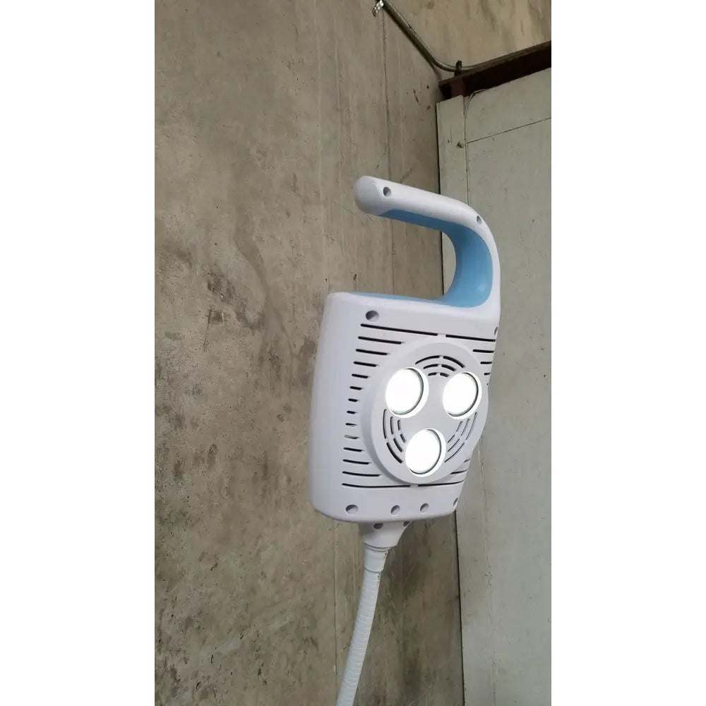 Welch allyn gs 600 exam light with rolling stand features a white and light blue handheld lamp with three circular led lights