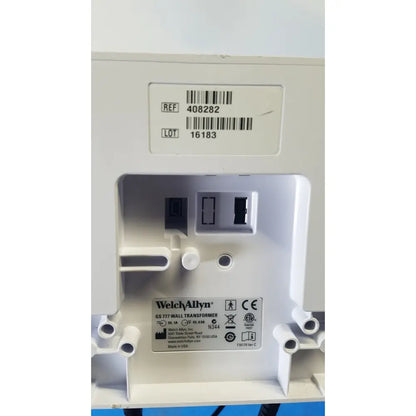 White plastic welch allyn gs 777 wall transformer with molded slots and label showing model and safety certifications