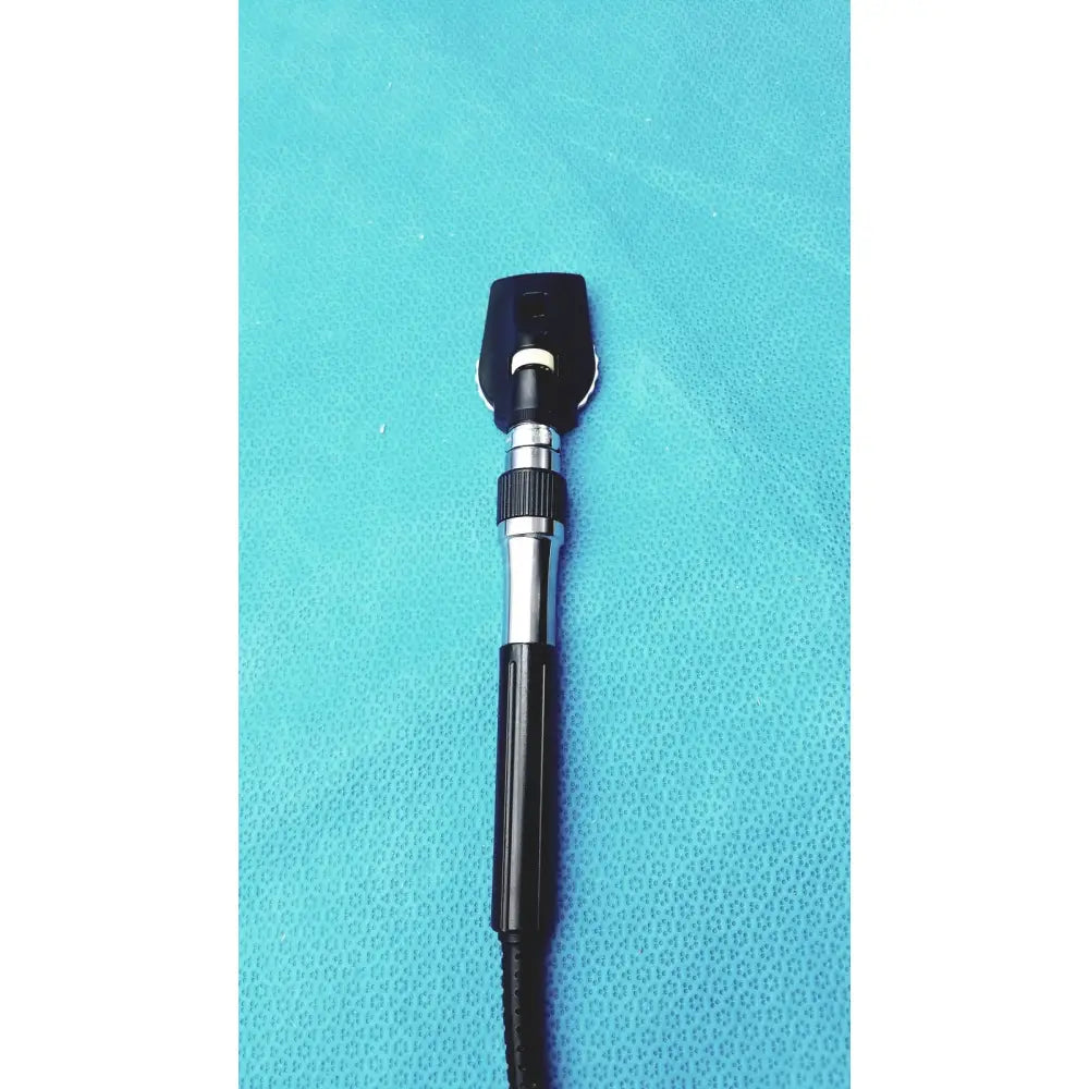 Black and silver welch allyn ophthalmoscope otoscope with textured grip handle for wall transformer use