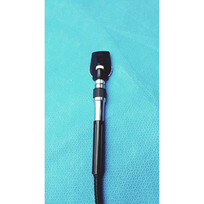 Black and silver welch allyn ophthalmoscope otoscope with textured grip handle for wall transformer use