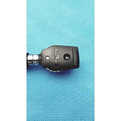 Black plastic and metal welch allyn ophthalmoscope head with textured grip for wall transformer reuse medical use