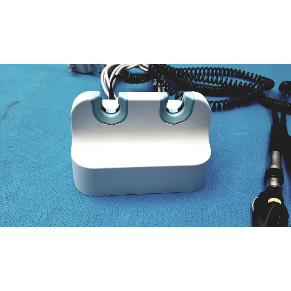 Welch allyn GS 777 wall transformer reuse medical device white plastic with light blue accents and two curved slots