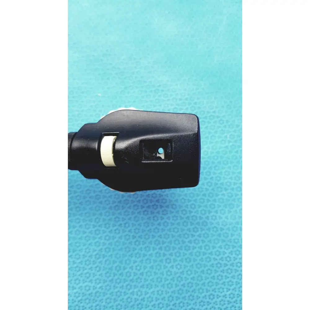 Black plastic Welch Allyn otoscope with white adjustment ring and blue light for wall transformer reuse medical use