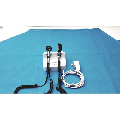 White medical otoscope with black handles and coiled cords for welch allyn wall transformer reuse medical use