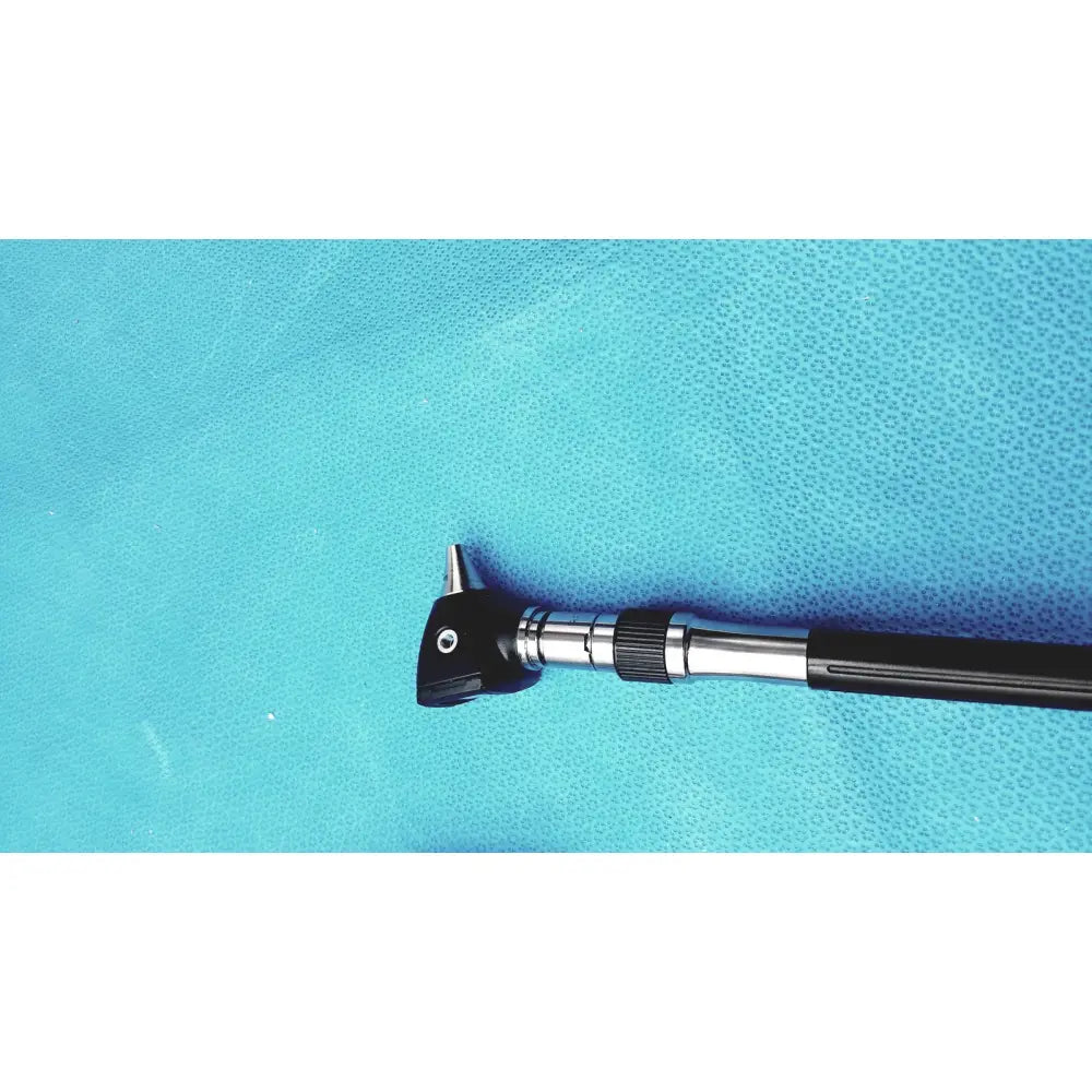 Welch allyn wall transformer with black and silver otoscope featuring a textured grip handle for reuse medical use