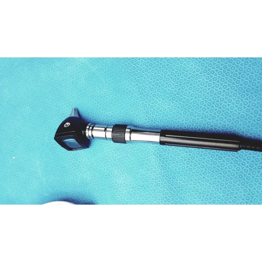Black and silver welch allyn ophthalmoscope otoscope with textured grip handle, part of gs 777 wall transformer system