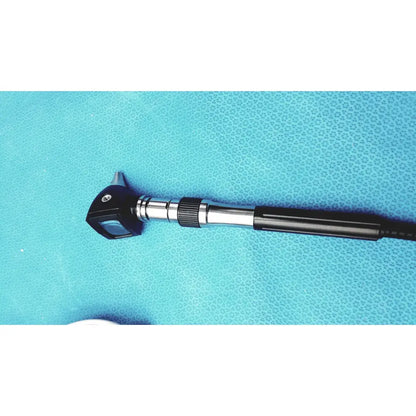 Black and silver welch allyn ophthalmoscope otoscope with textured grip handle, part of gs 777 wall transformer system