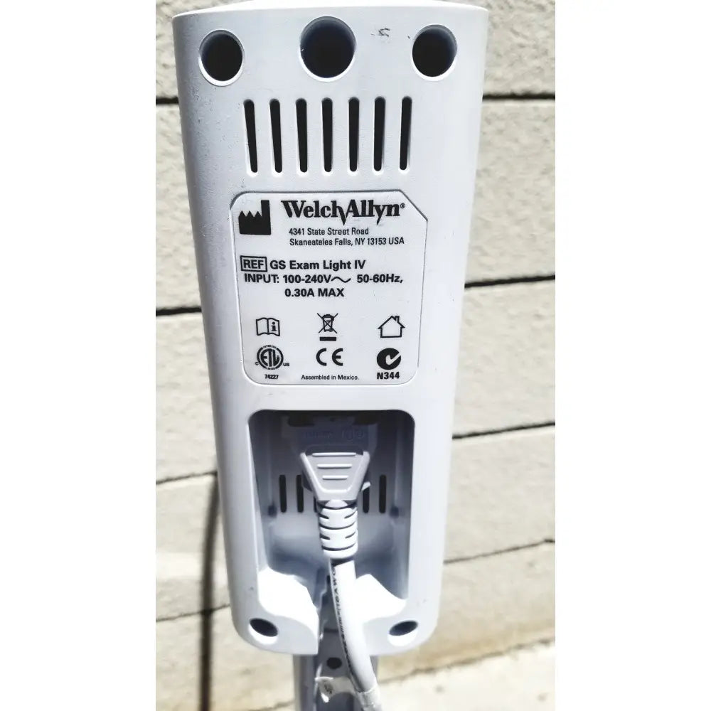 White plastic welch allyn gs exam light iv showing rear side with power cord plugged into exam light port