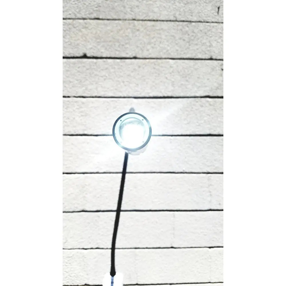 Welch Allyn GS exam light IV circular bright white LED fixture with clear glass cover and black cord for medical use