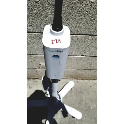White welch allyn gs exam light iv with black pole and four white caster wheels for reuse medical settings