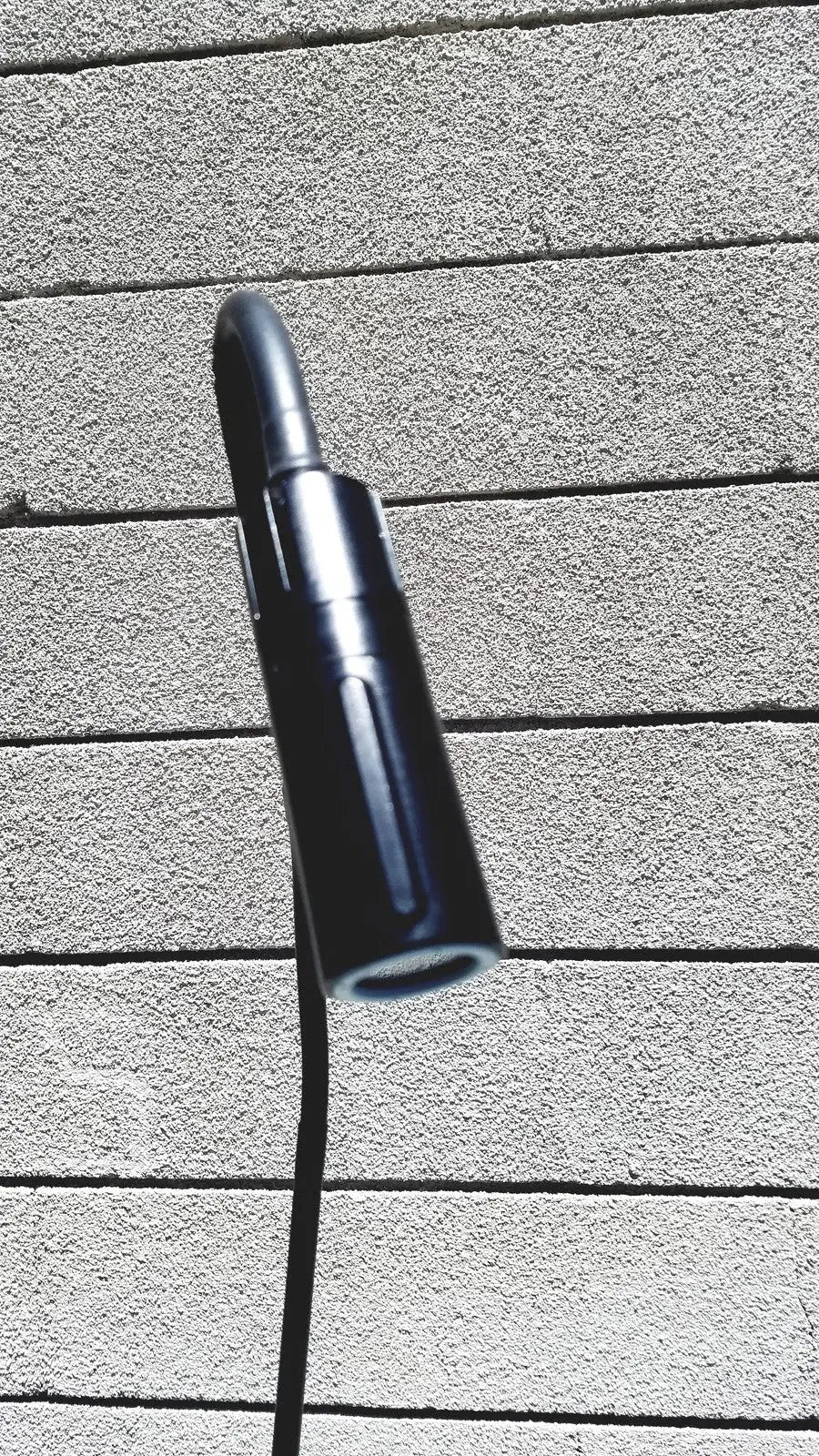 Black cylindrical welch allyn gs exam light iv with sleek modern design and textured grip for medical use