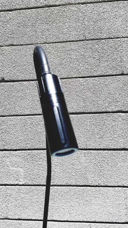 Black cylindrical welch allyn gs exam light iv with sleek modern design and textured grip for medical use