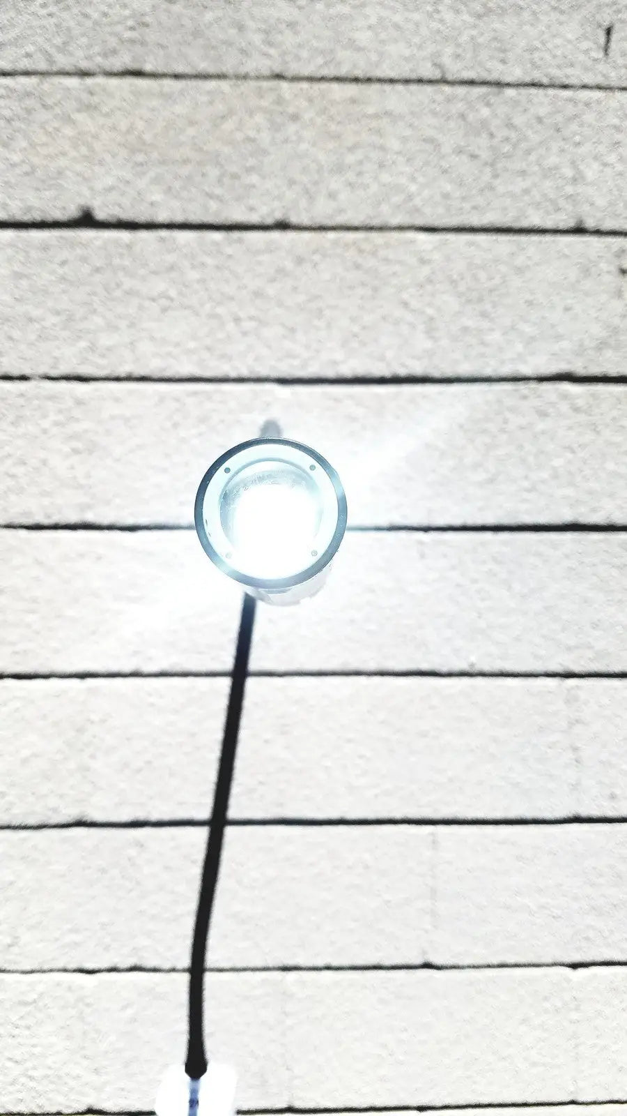Welch Allyn GS exam light IV circular bright white LED fixture with clear glass cover and black cord for medical use