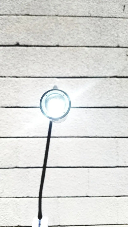 Welch Allyn GS exam light IV circular bright white LED fixture with clear glass cover and black cord for medical use