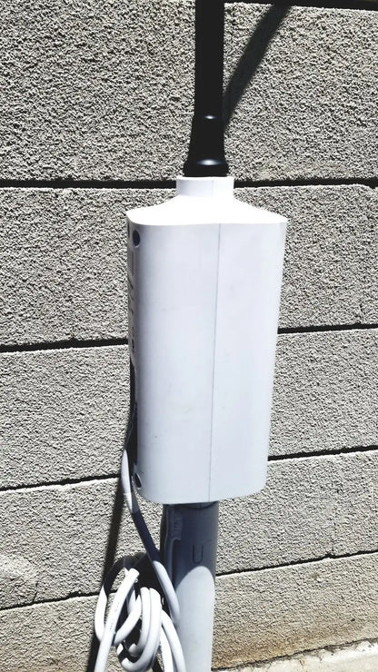 White rectangular outdoor power outlet box mounted on pole for welch allyn gs exam light iv reuse medical setup
