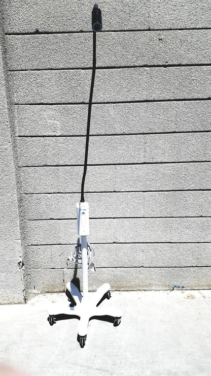 White welch allyn gs exam light with adjustable arm and black cord for medical examination lighting