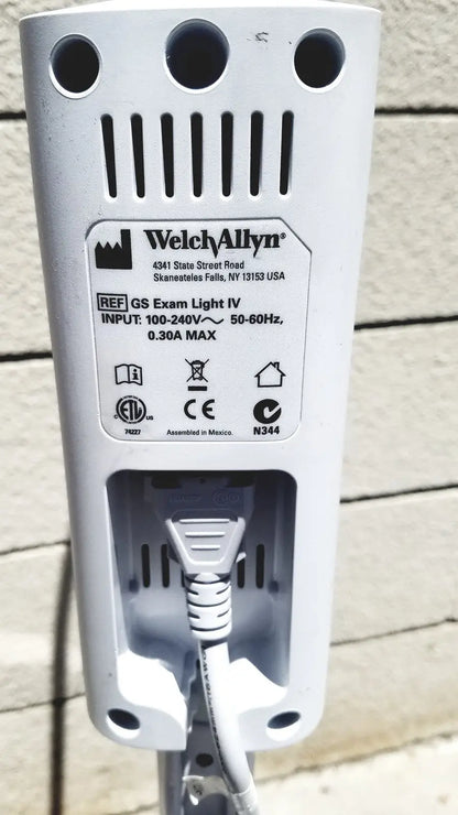 White plastic welch allyn gs exam light iv showing rear side with power cord plugged into exam light port