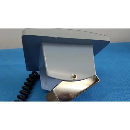 Gray plastic wall-mounted phone with metallic base and black cord for welch allyn large adult blood pressure cuff use