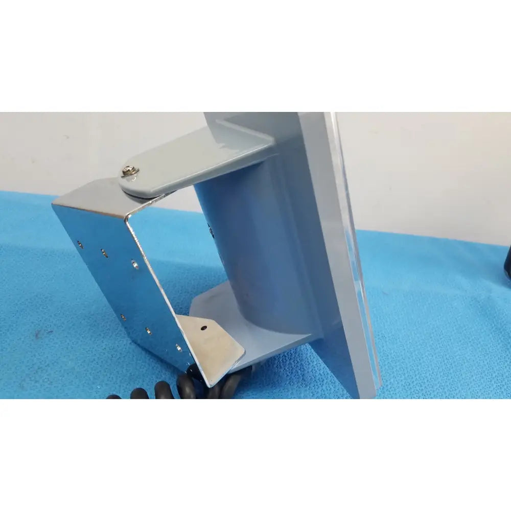 Gray metallic industrial mounting bracket with cylindrical component and screws for welch allyn large adult blood pressure cuff