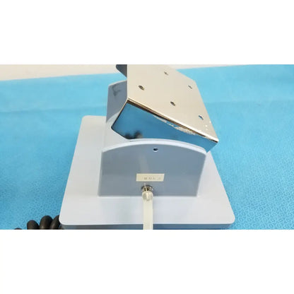 Silver metallic clamp with adjustable arm and rectangular base on a gray stand for welch allyn large adult blood pressure cuff