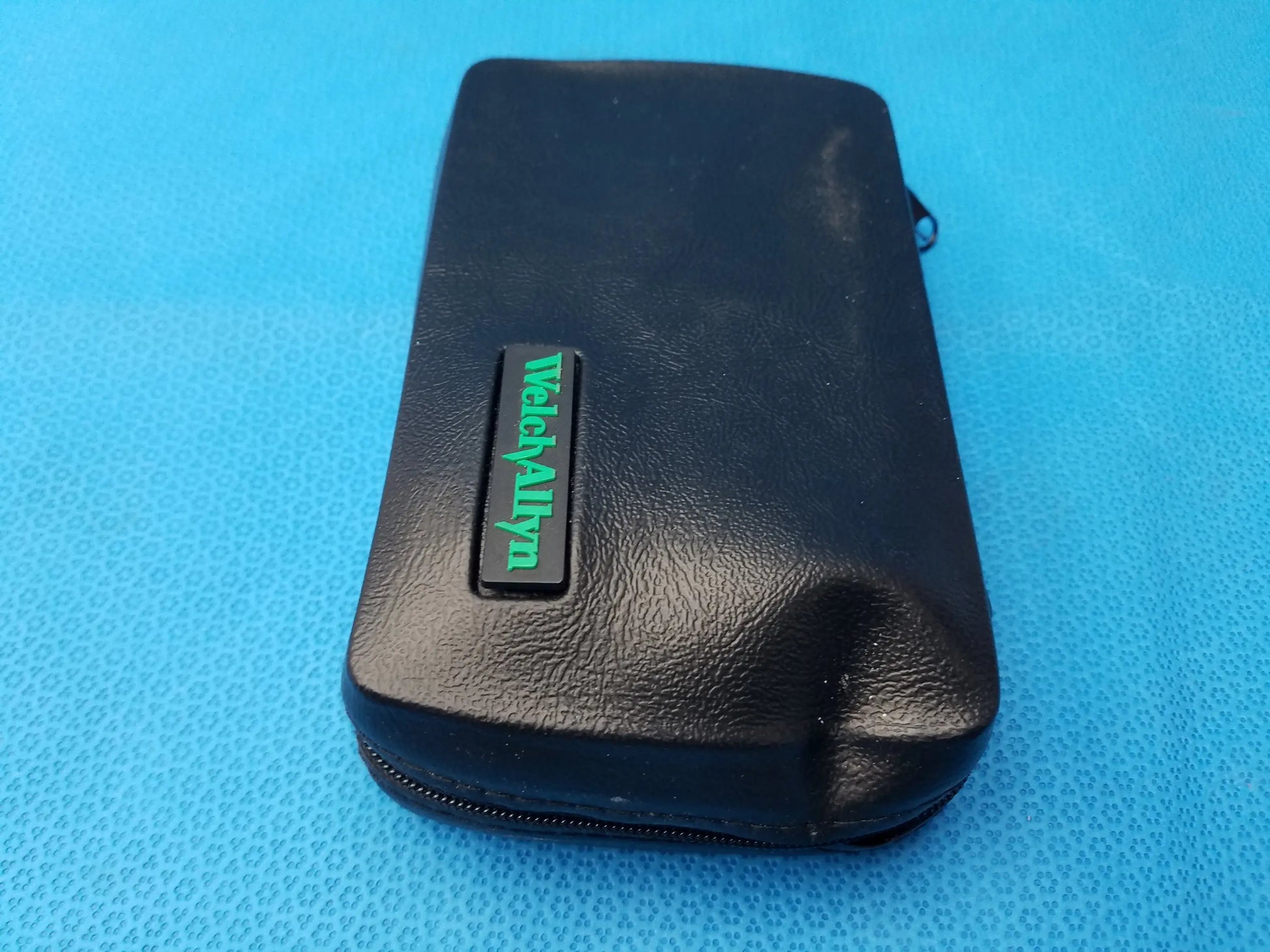 Black leatherette case with green wecyalynn logo plaque for Welch Allyn LED MacroView otoscope and ophthalmoscope set with LED illumination