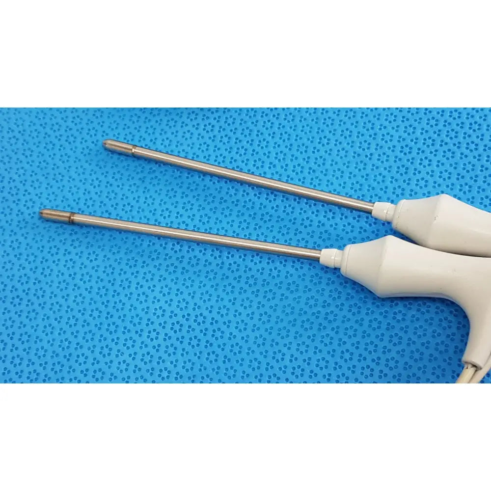 Two metallic surgical forceps with white plastic handles in welch allyn probe well kit rectal lot of 2