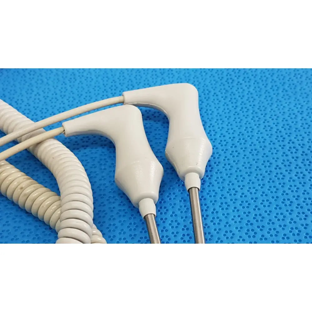 White plastic-handled welch allyn probe with metallic ultrasound transducers and coiled cables in a lot of 2