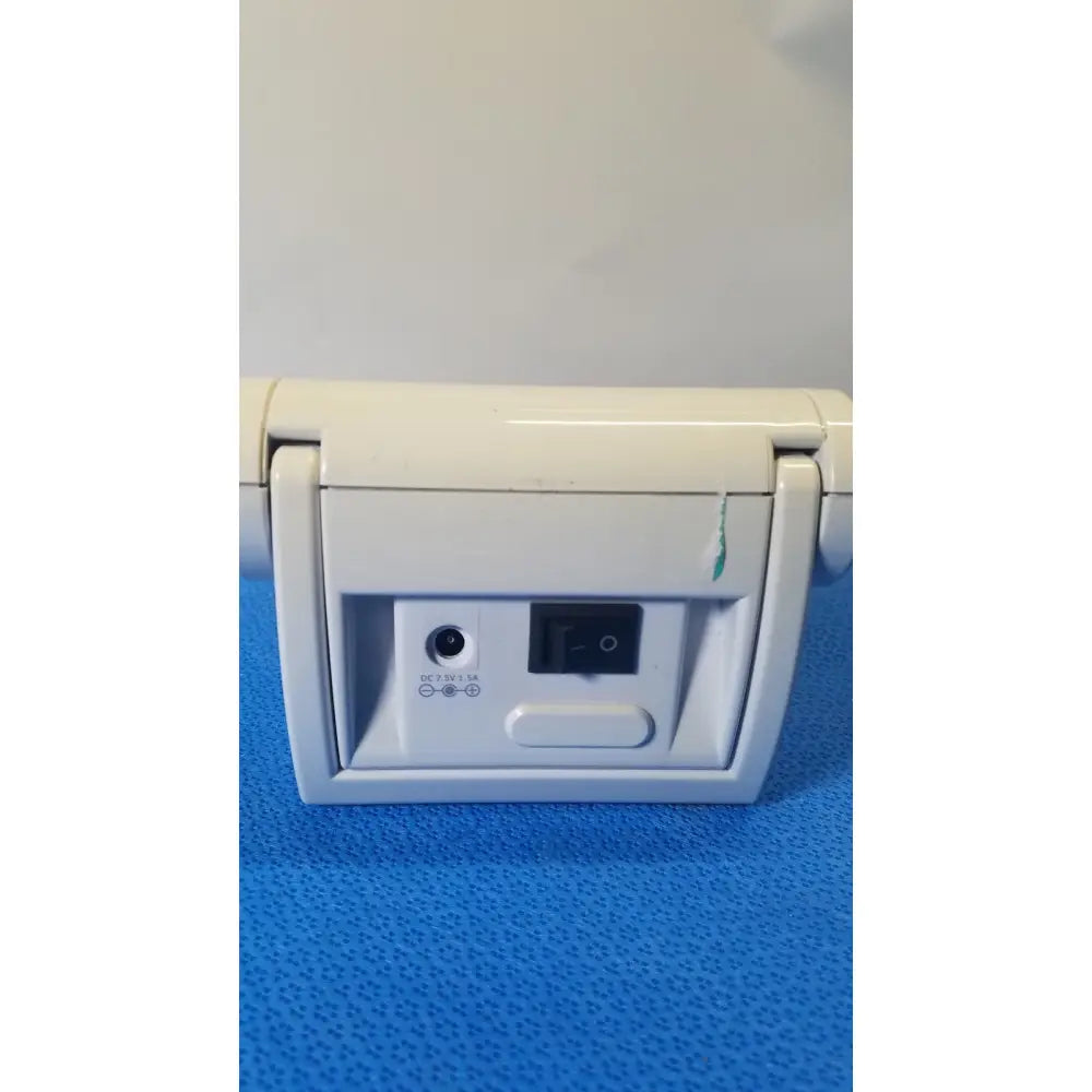 Rear view of off-white plastic desk fan with power switch and dc input port for welch allyn probp 2400 digital blood pressure device