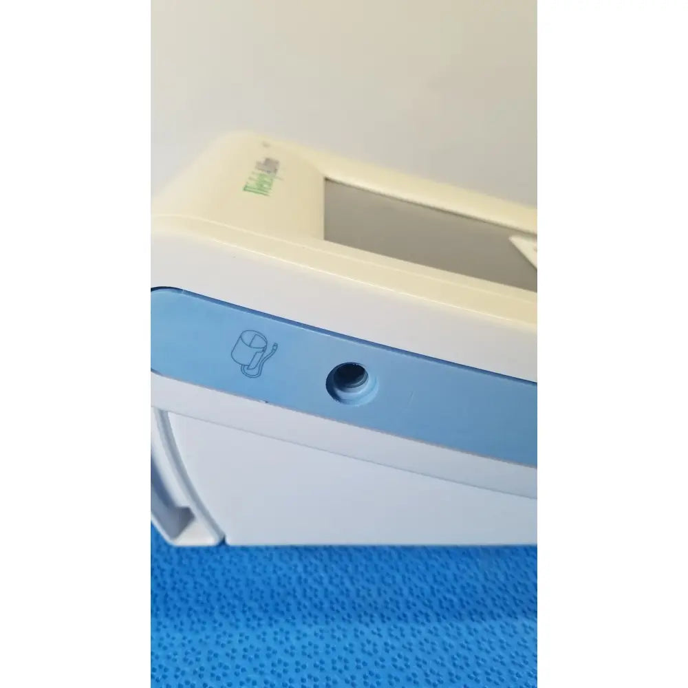 Beige and light blue welch allyn probp 2400 digital blood pressure device showing small circular port on the side