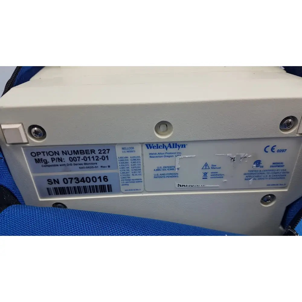 White plastic welch allyn propaq encore 202 el patient monitor option box with printed labels and serial number on back