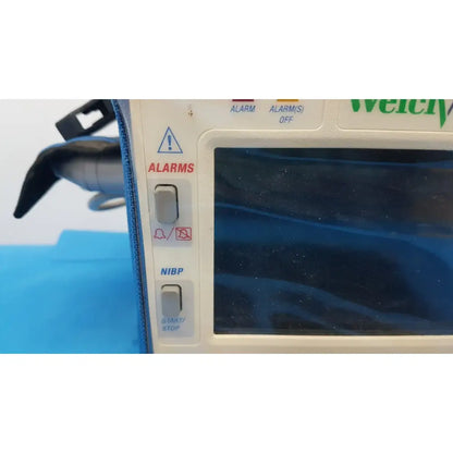 Welch allyn propaq encore 202 el patient monitor with blue screen and control buttons for alarms and NIBP