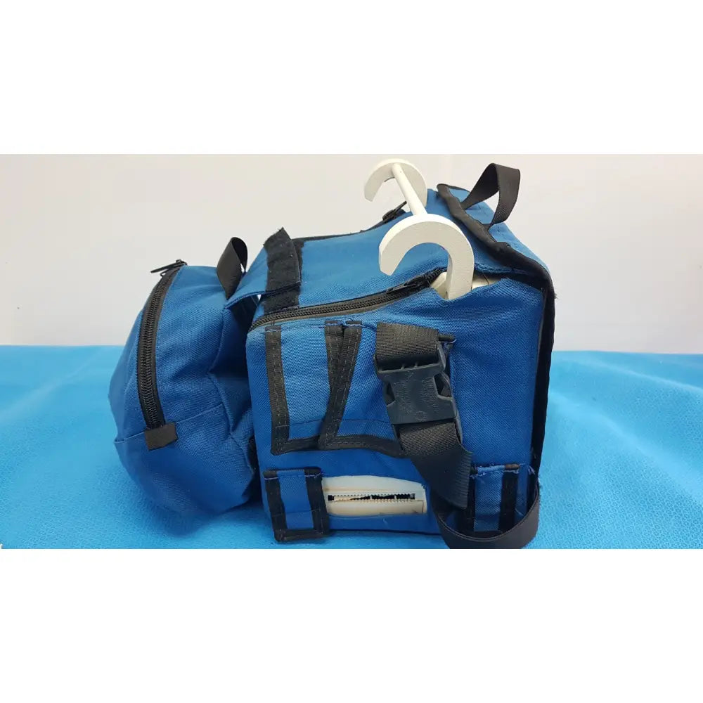 Blue fabric backpack with black zippers and straps featuring white hanger compatible with welch allyn propaq encore patient monitor