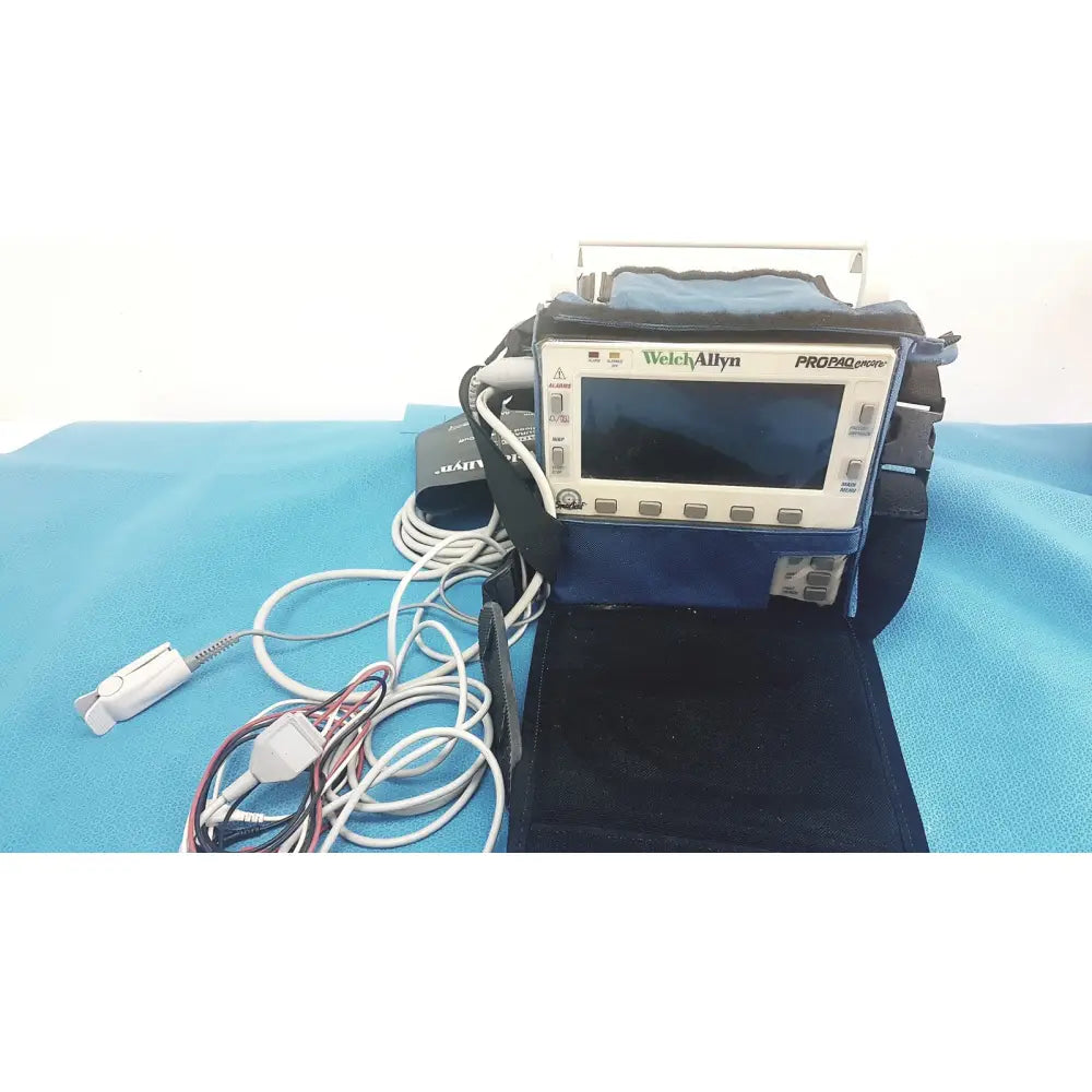 Welch allyn propaq encore patient monitor with white gray casing black carrying case and multiple cables for portable use