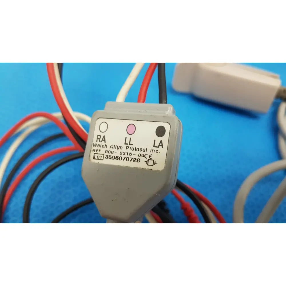 Gray plastic electrical connector with labeled ra ll and la terminals on the back of welch allyn propaq encore monitor