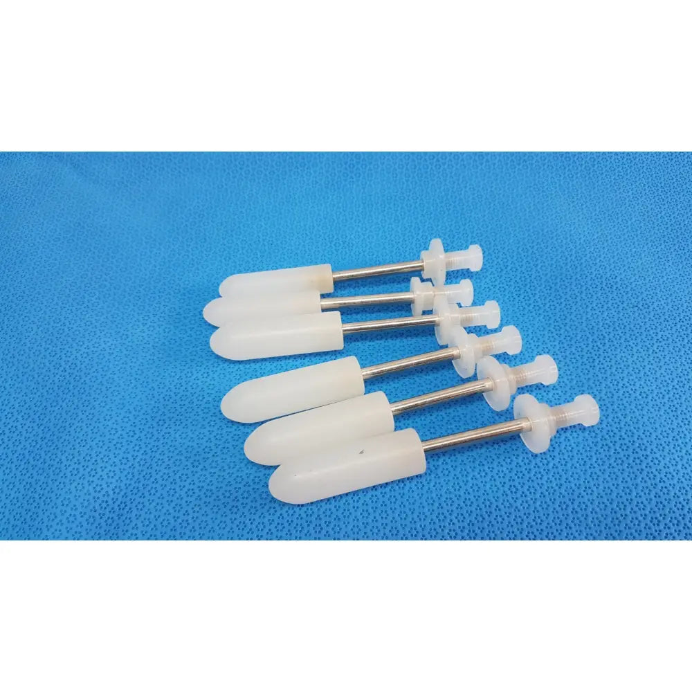 White plastic wall plugs with metallic shafts for durable medical fluid transfer in welch allyn rotary filling pumps lot of 5