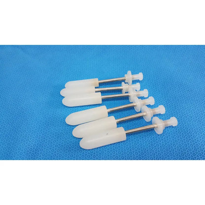 White plastic wall plugs with metallic shafts for durable medical fluid transfer in welch allyn rotary filling pumps lot of 5