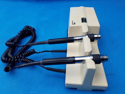 Beige welch allyn series transformer with two black-handled probes and coiled cords for diagnostic use