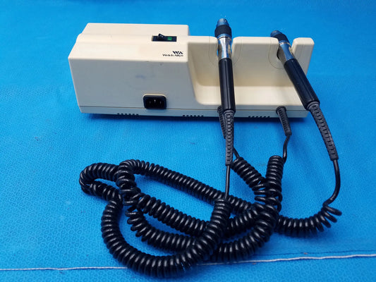 Beige plastic welch allyn series transformer with otoscope and ophthalmoscope no heads featuring two black probes and coiled cords