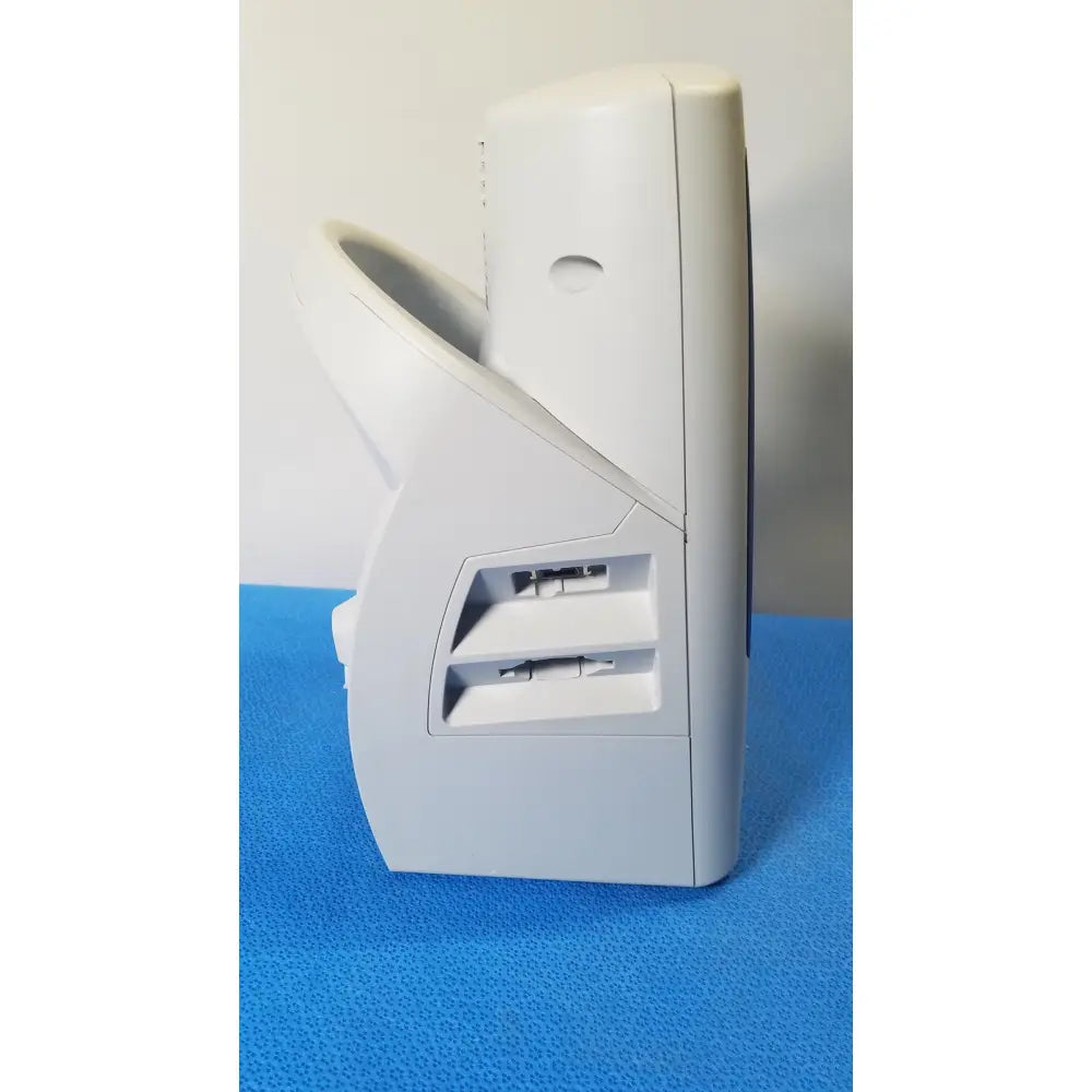 White plastic card reader with two horizontal slots for cards on the back of welch allyn spot vital signs patient monitor