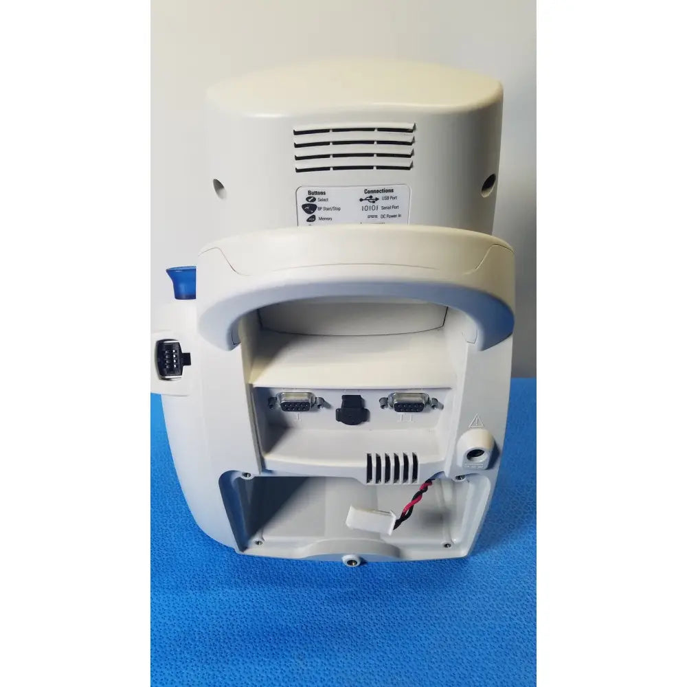 White welch allyn spot vital signs lxi patient monitor with curved handle multiple ports and button function label