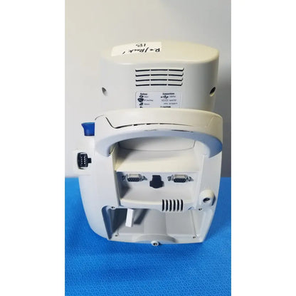 White welch allyn spot vital signs lxi medical monitor back side with curved handle and multiple ports visible