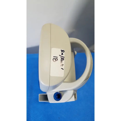 Beige plastic dental handpiece with blue circular port and white label for welch allyn spot vital signs lxi device