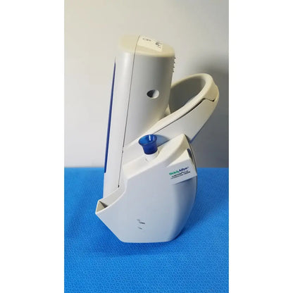 White plastic welch allyn spot vital blood pressure monitor with blue cap on cuff attachment point