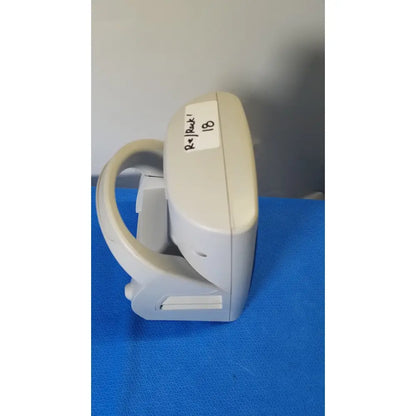 Beige plastic welch allyn spot vital signs lxi medical device with curved handle and labeled sticker for vital monitoring