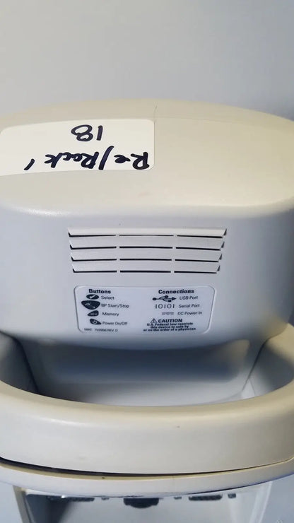 Beige plastic welch allyn spot vital signs lxi device with labeled buttons and ports for medical monitoring use