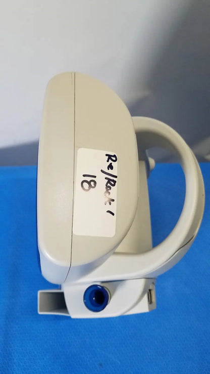 Beige plastic dental handpiece with blue circular port and white label for welch allyn spot vital signs lxi device