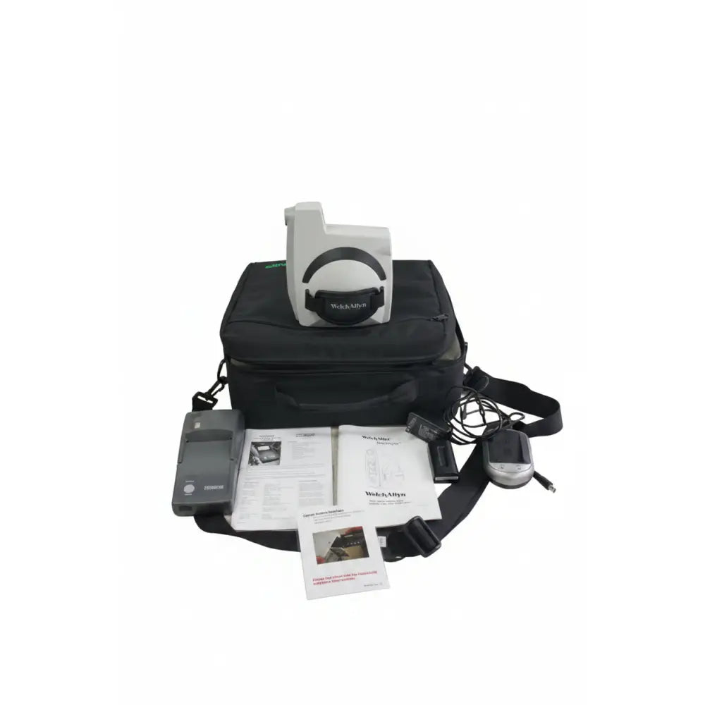 White and black welch allyn suresight vision screener 140 series with circular design resting on black carrying case