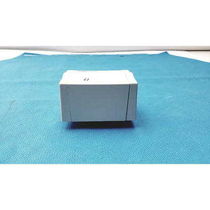 White plastic welch allyn universal kleenspec single use specula dispenser with 17 printed on top surface