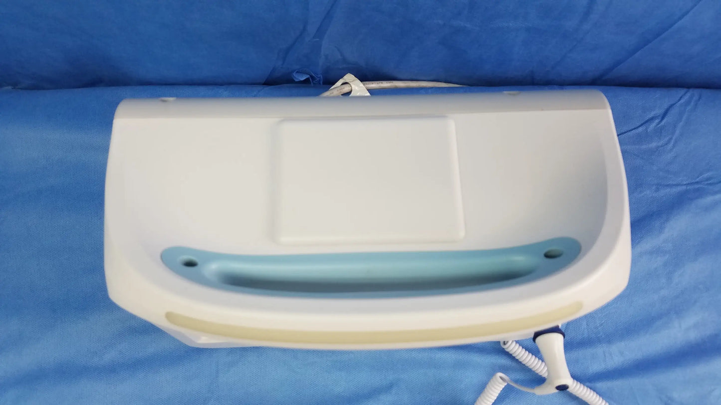 White plastic welch allyn vital signs monitor 6000 series with light blue handle and beige trim for blood pressure cuffs