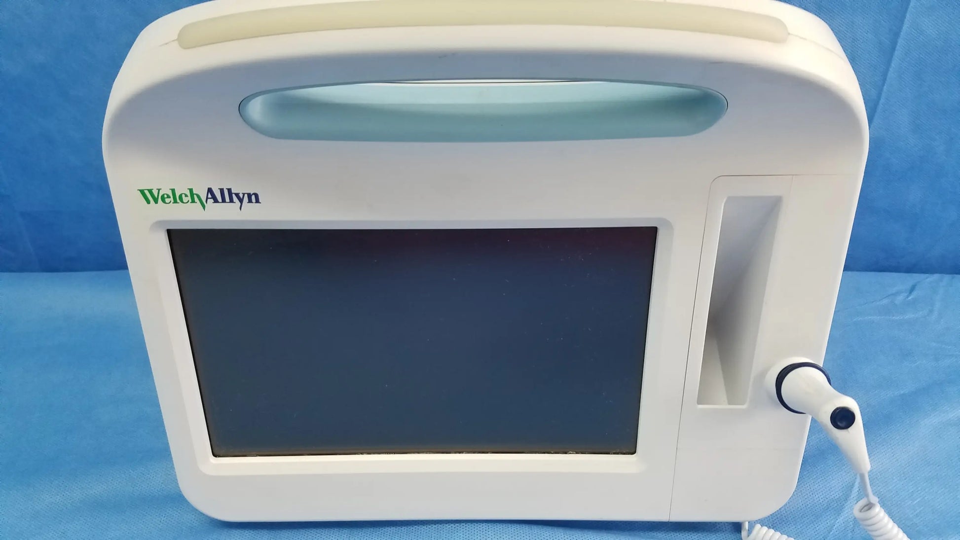 White welch allyn vital signs monitor 6000 series with rectangular screen, integrated handle, cables, and blood pressure cuffs